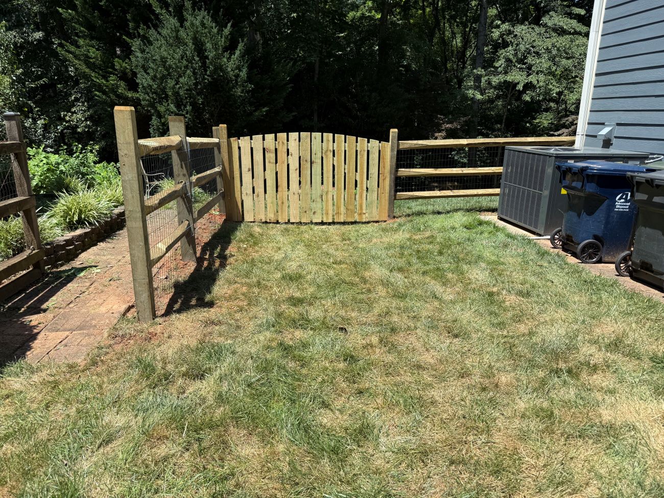 Split rail fence installed in huntersville with a double gate